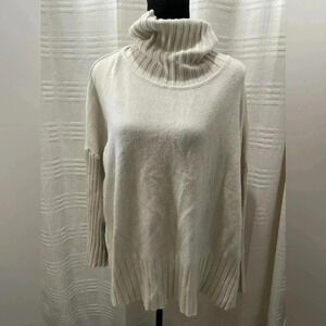 RAYA cream turtleneck sweater with split sides